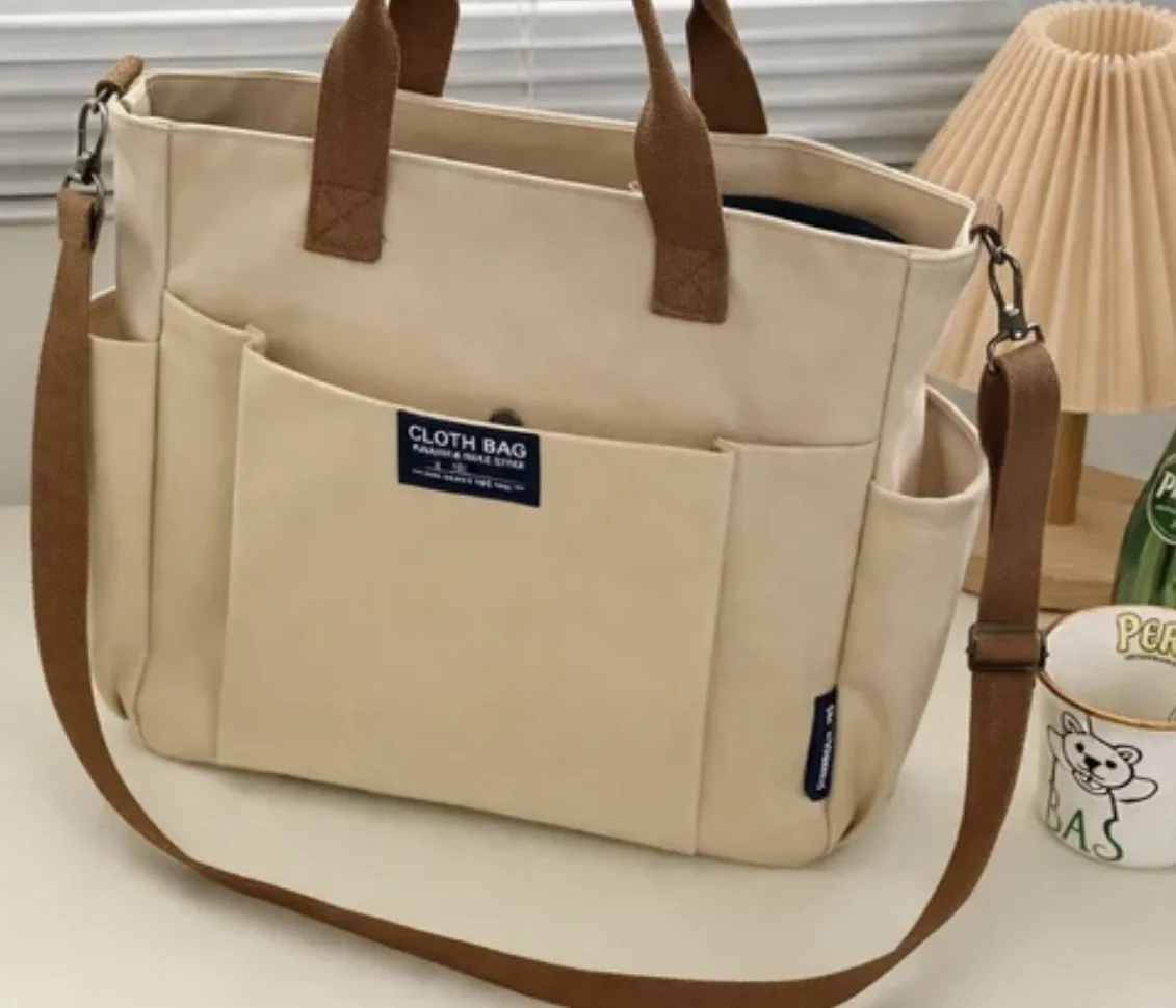 Bolsa grande de ombro em lona alça transversal
